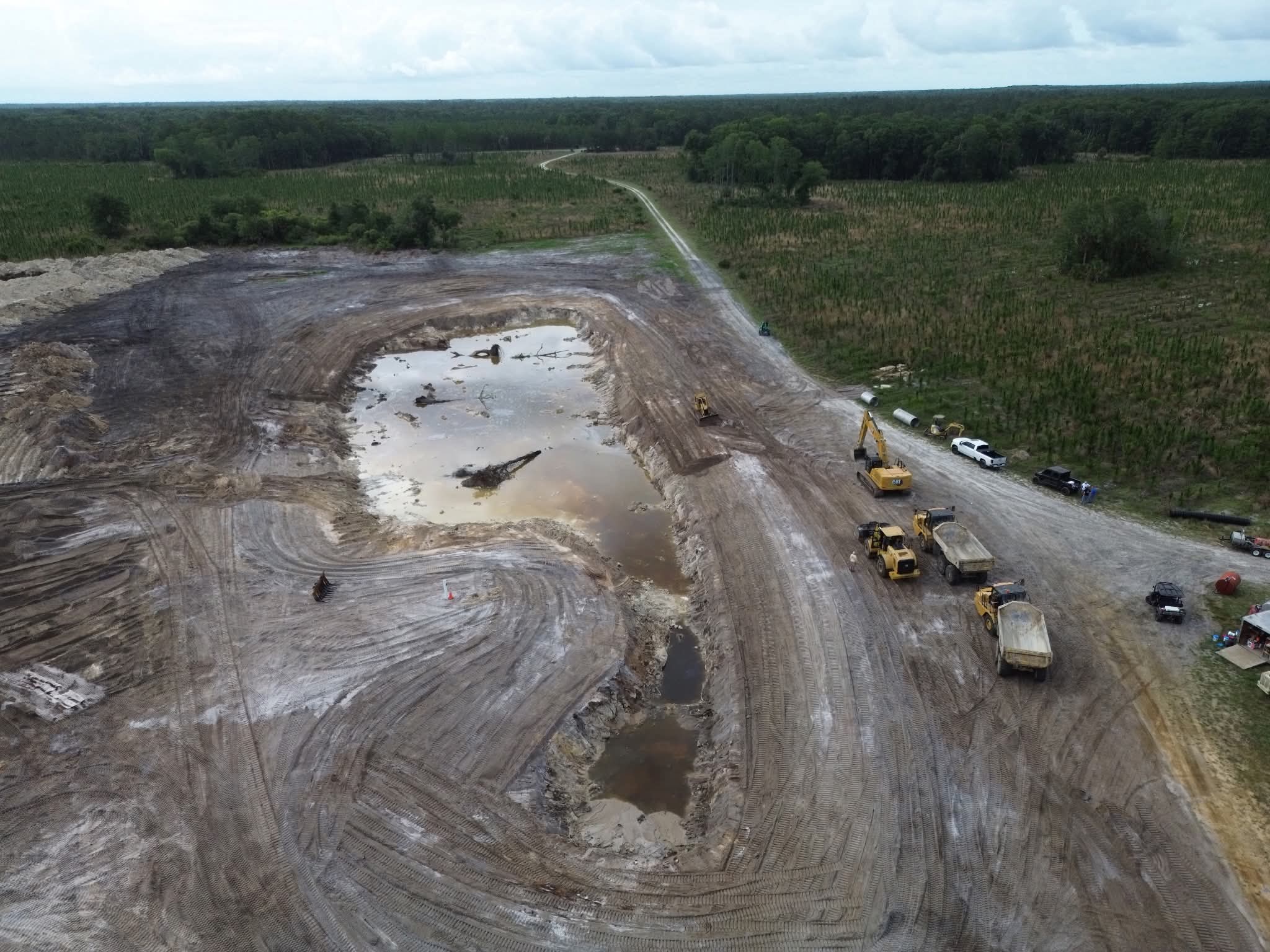 Site development excavation for a two-acre pond by Florida Hauling & Demo