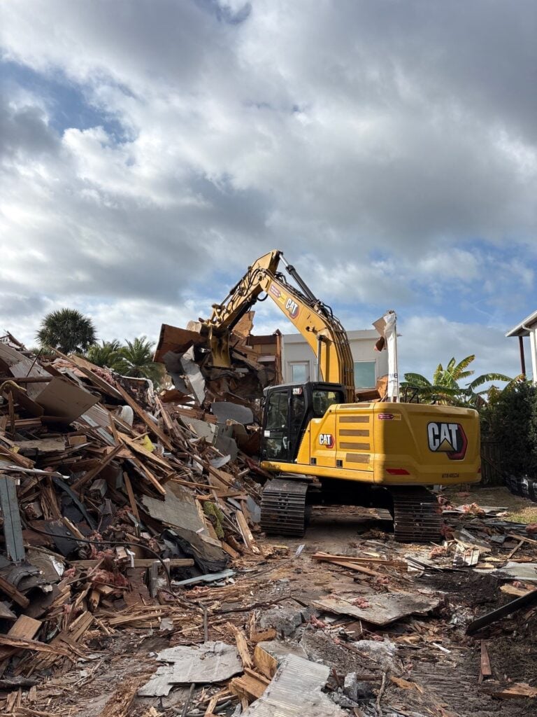 Full house demolition project with structural teardown and debris removal